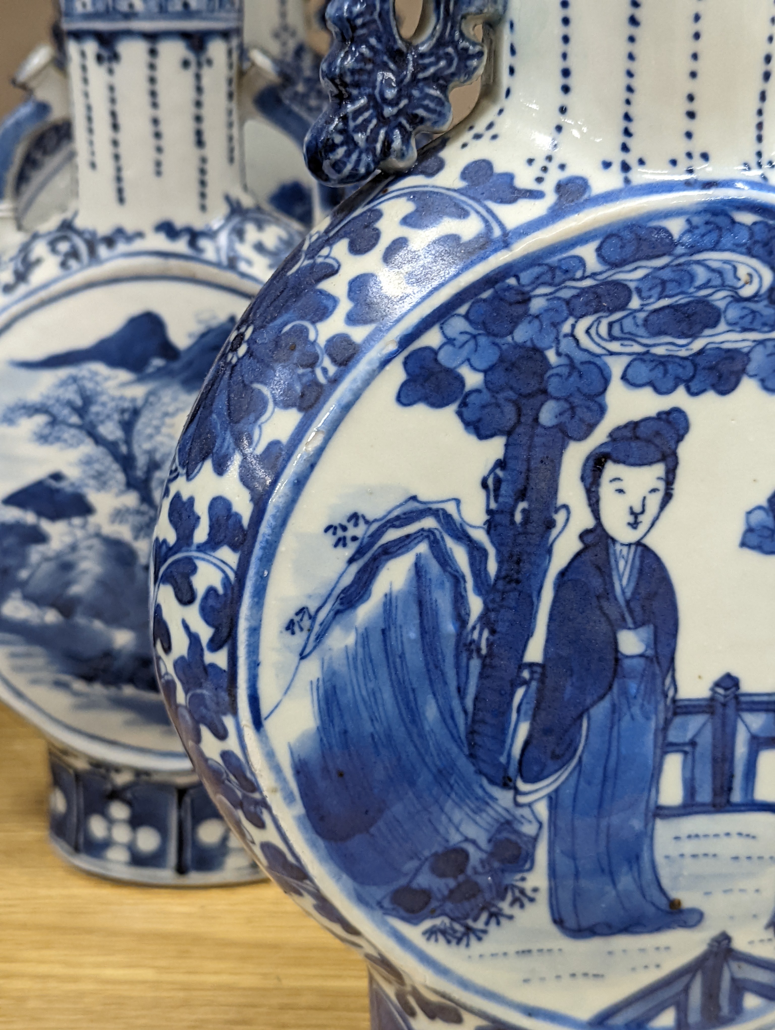 Three 19th century Chinese blue and white Moon flasks, tallest 31 cms.